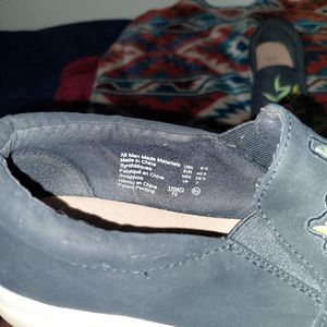 Black slip on shoe with embroidery